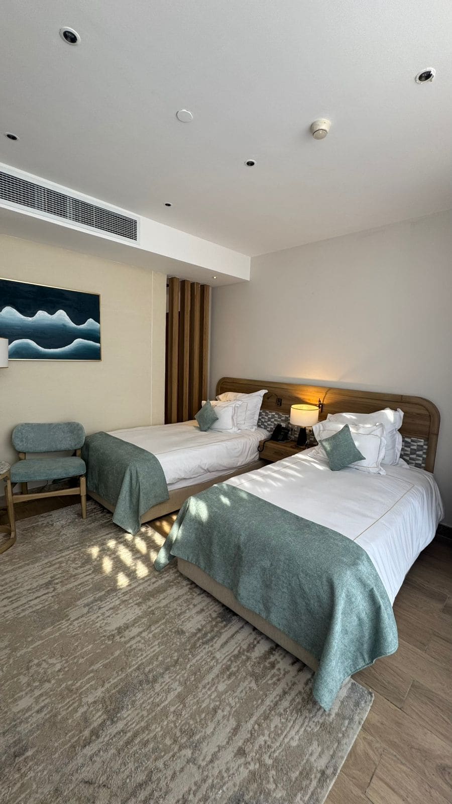 A twin guest room at Rixos Montaza