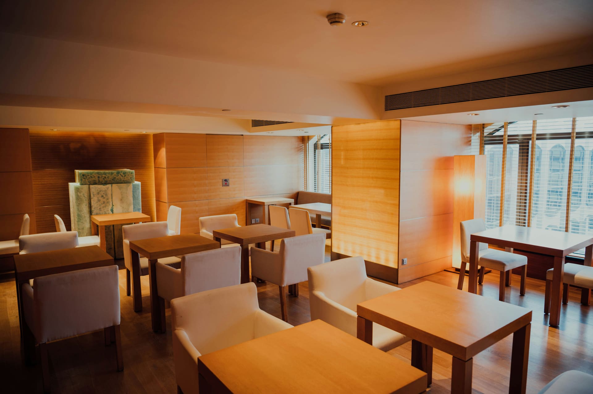 A restaurant interior set for dinner